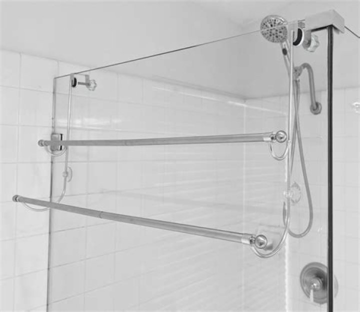 Can you put a towel rack on a glass shower door?