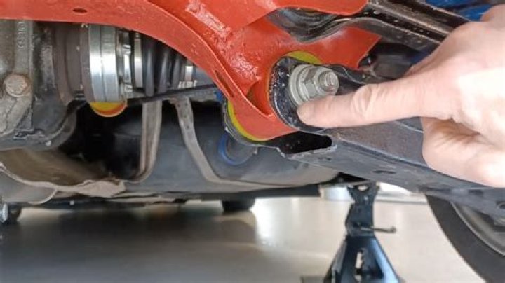 How do you adjust the rear brakes on a Honda ATV?