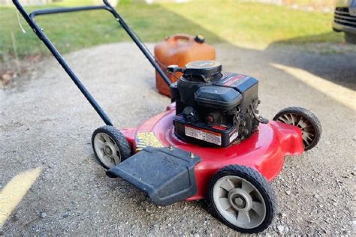 How do you clean a carburetor on a Murray lawn mower?