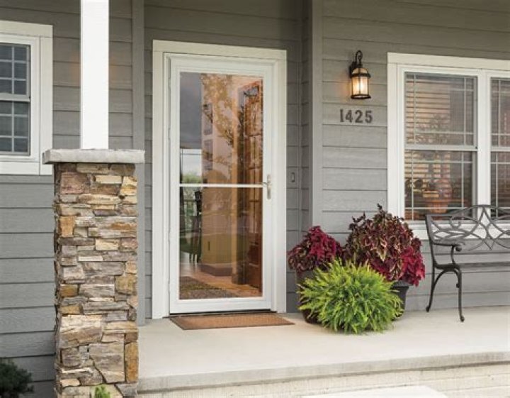What does self storing storm door mean?